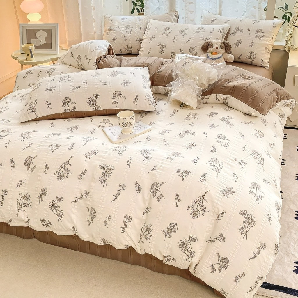 light brown floral print on a creamy and brown textured duvet cover bedding set